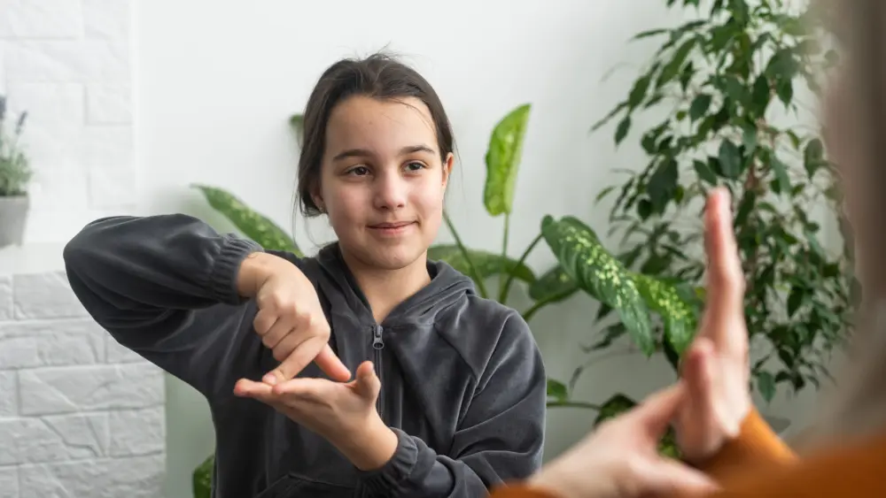 small-caucasian-teen-girl-child-do-articulation-exercises-with-caring-mother-or-teacher-at-home-little-kid-pronounce-sounds-speak-talk-with-tutor-or-coach-engaged-in-voice-pronunciation-together