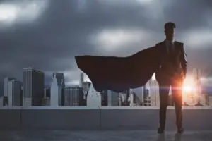 businessman-with-red-hero-cape-standing-on-rooftop-2026-03-26-05-28-41-utc