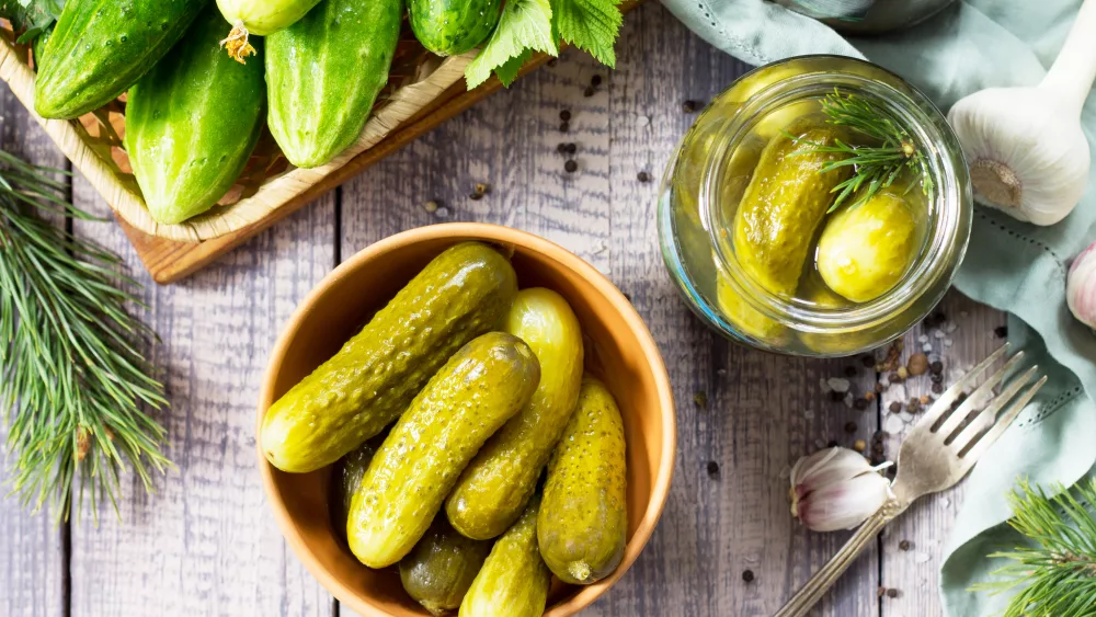marinated-cucumbers-gherkins-pickles-with-fir-branch-on-the-kit