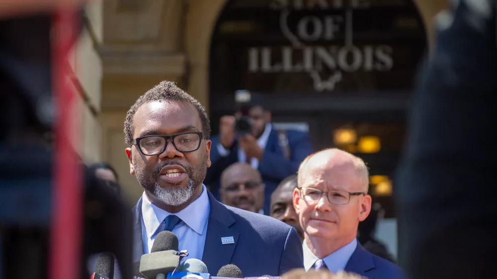 Chicago Mayor-elect Brandon Johnson speaks to reporters outside of the Illinois State Capitol Wednesday after addressing a joint session of the General Assembly. Also pictured is Senate President Don Harmon. (Capitol News Illinois photo by Jerry Nowicki)