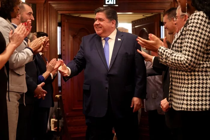 Governor J.B. Pritzker arrives to deliver his State of the State and budget address before the General Assembly at the Illinois State Capitol, Wednesday, Feb. 21, 2024. (Brian Cassella/Chicago Tribune/pool)
