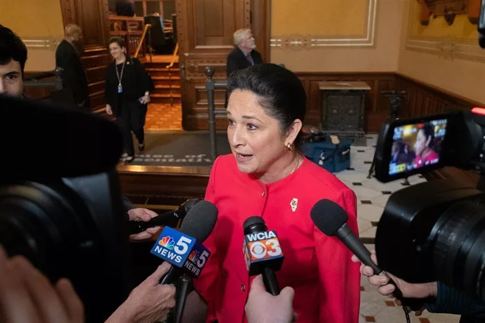 Illinois Comptroller Susana Mendoza – the state’s chief financial officer – is swarmed by reporters for her reaction to Gov. JB Pritzker’s proposed budget moments after leaving the House of Representatives chambers. (Capitol News Illinois photo by Andrew Adams)