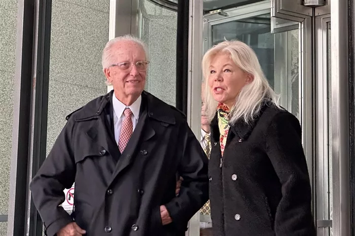 Former Democratic state Sen. Terry Link exits the Dirksen Federal Courthouse in Chicago with his attorney Catharine O'Daniel on Wednesday after being sentenced to three years’ probation on tax evasion charges. He was also ordered to repay nearly $83,000 in restitution to the state and federal government. (Capitol News Illinois photo by Dilpreet Raju)