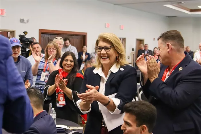 Incoming Illinois Republican Party Chair Kathy Salvi receives applause on Wednesday during the Illinois delegation’s breakfast prior to Republican National Convention programming in Milwaukee. (Capitol News Illinois photo by Andrew Adams)