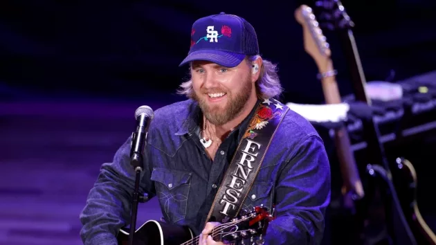 getty_ernestdenimjacketguitar896938