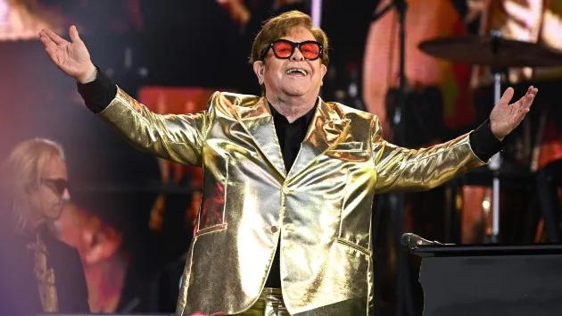getty_eltonjohngoldsuit_100423315530