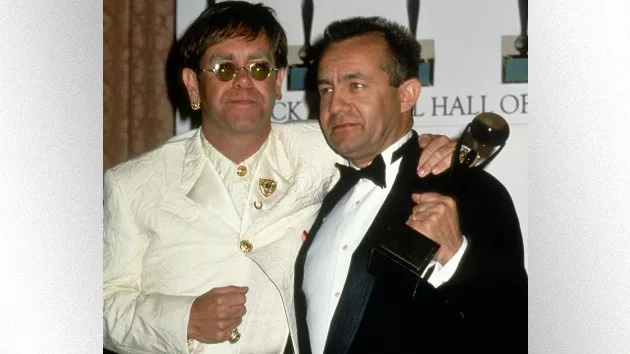 getty_eltonandbernierockhall_103023177945