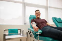 young-man-lying-while-donating-blood-at-the-blood-bank