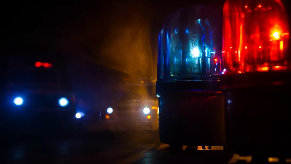 policecarblueandredroundvintagesirenindark