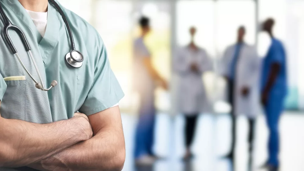 aclose-upofahealthcareprofessionalinscrubswitharms