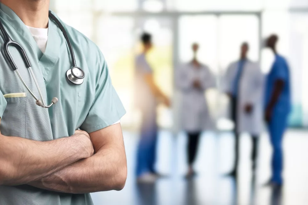 aclose-upofahealthcareprofessionalinscrubswitharms