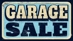 agedandworngaragesalesignonwood