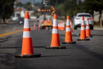 trafficconesonroadwithelectronicarrowpointingtothe
