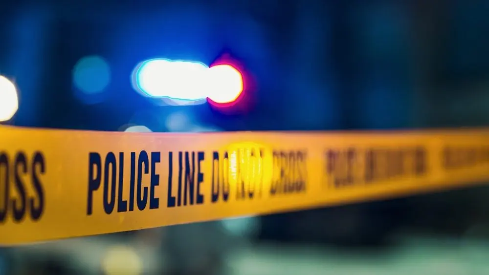 closeupshotfocusedonyellowtapeshowingtextpolice