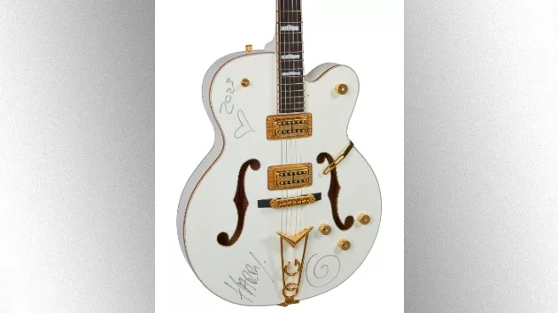 m_harrystylesguitarauction_011124586897