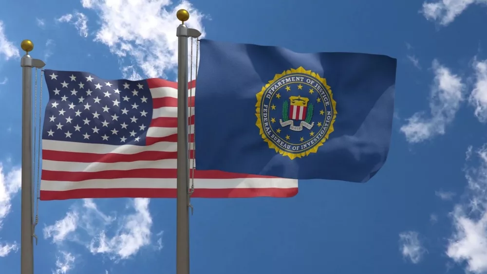 FBI Flag together with American Flag^ USA^ Close-up Frontal on a Pole with blue cloudy sky^ 3D Render