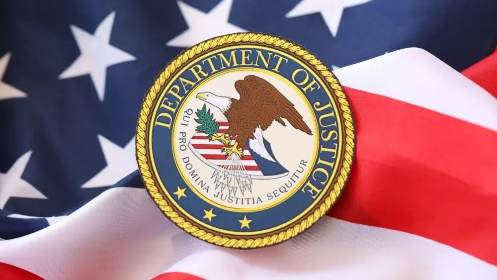US Department of Justice seal on United States of America flag close up