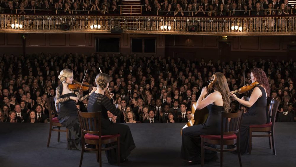 quartet-performing-on-stage-in-theater