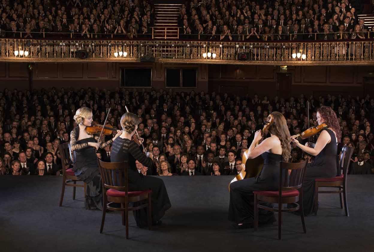 quartet-performing-on-stage-in-theater