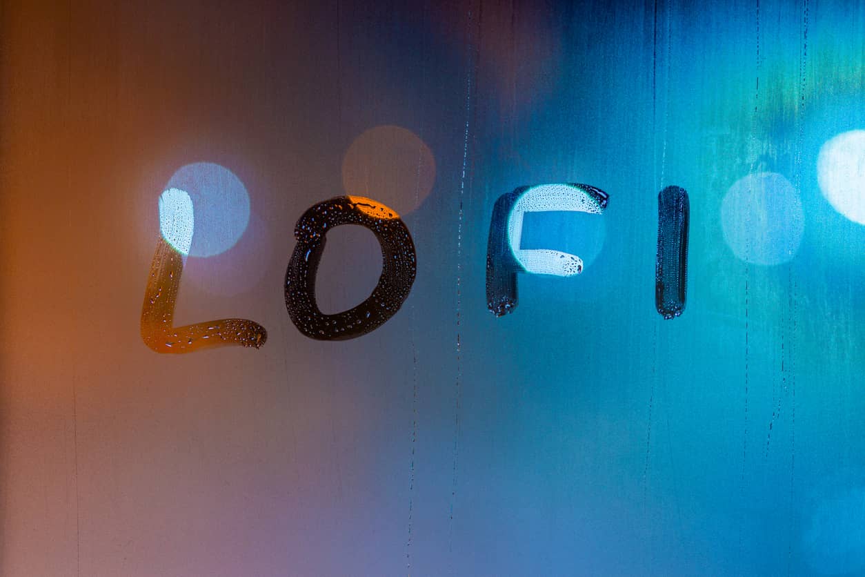 the-word-lofi-written-by-finger-on-night-wet-window-glass-blue-and-orange-colors