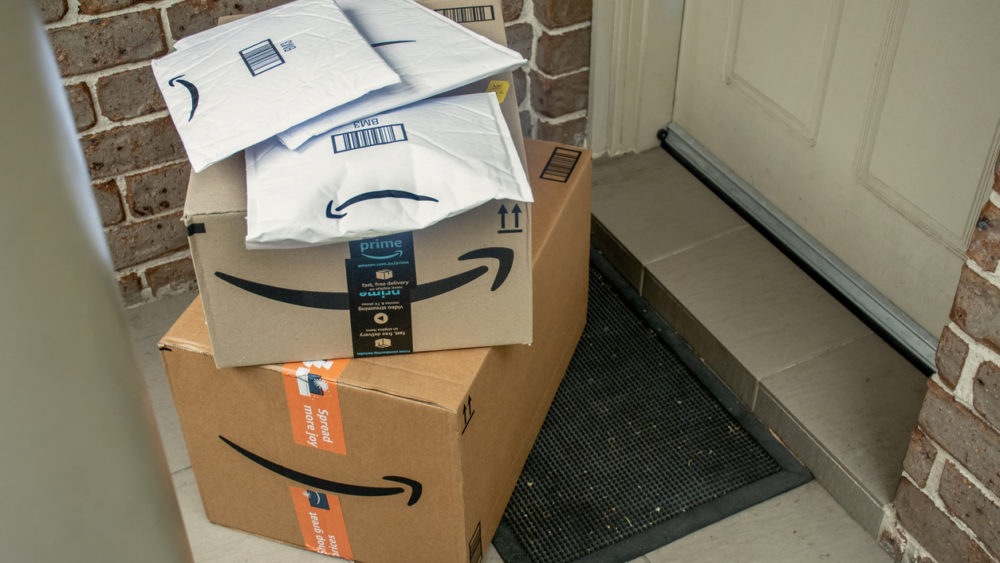 amazon-prime-boxes-and-envelopes-delivered-to-a-front-door-of-residential-building