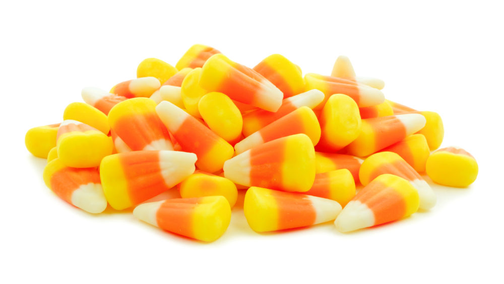 pile-of-halloween-candy-corn-over-white
