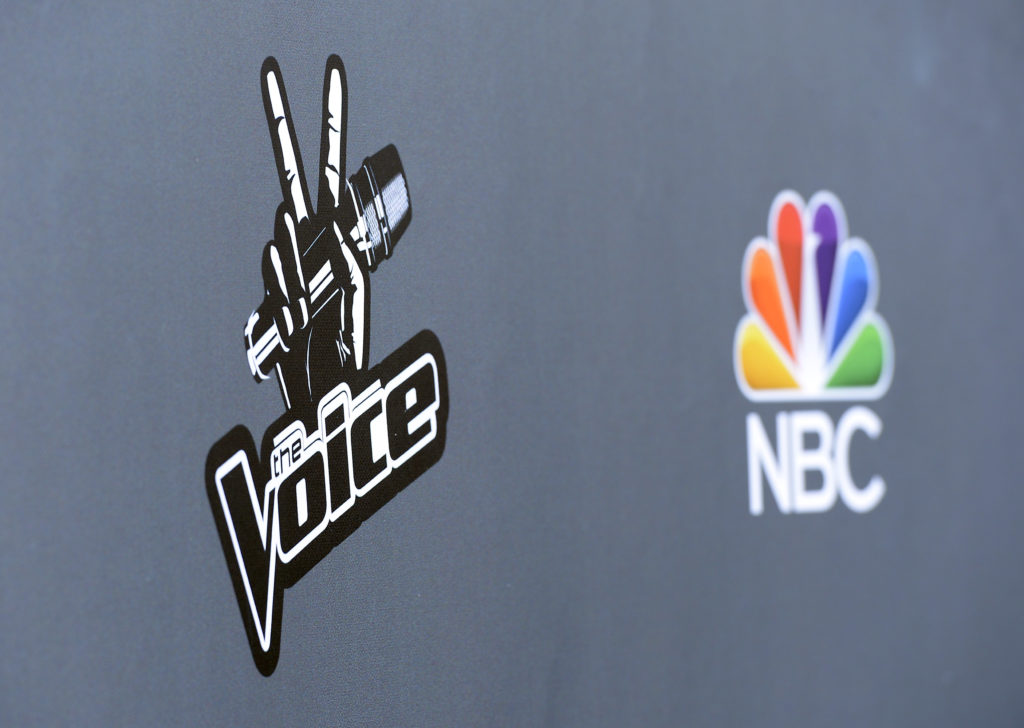 the-logos-of-television-show-the-voice-and-national-broadcasting-company-nbc-are-seen-during-a-media-event-in-universal-city