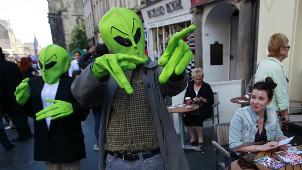 actors-dressed-wearing-alien-masks-walk-among-the-public-in-the-royal-mile-during-the-edinburgh-festival-fringe-in-edinburgh