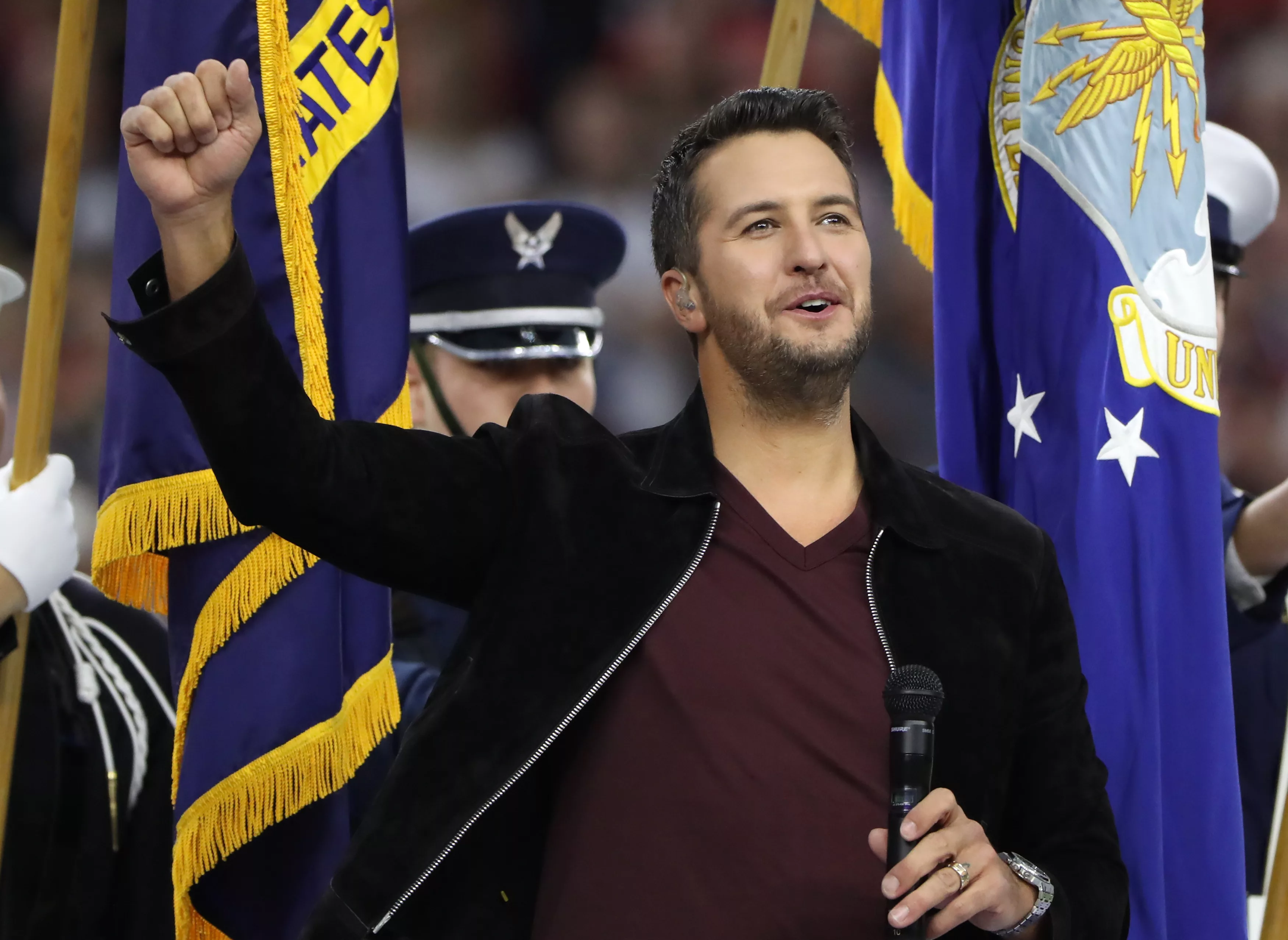 country-singer-luke-bryan-reacts-after-performing-the-u-s-national-anthem-prior-to-the-start-of-super-bowl-li-between-the-new-england-patriots-and-the-atlanta-falcons-in-houston
