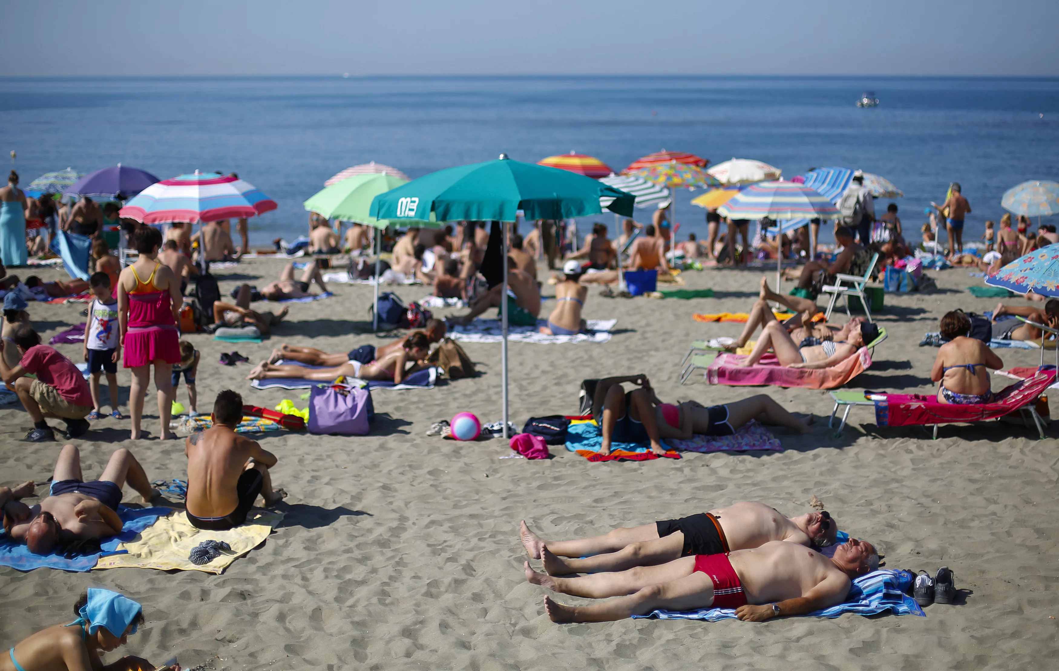 people-sunbath-at-ostia-beach-west-of-rome