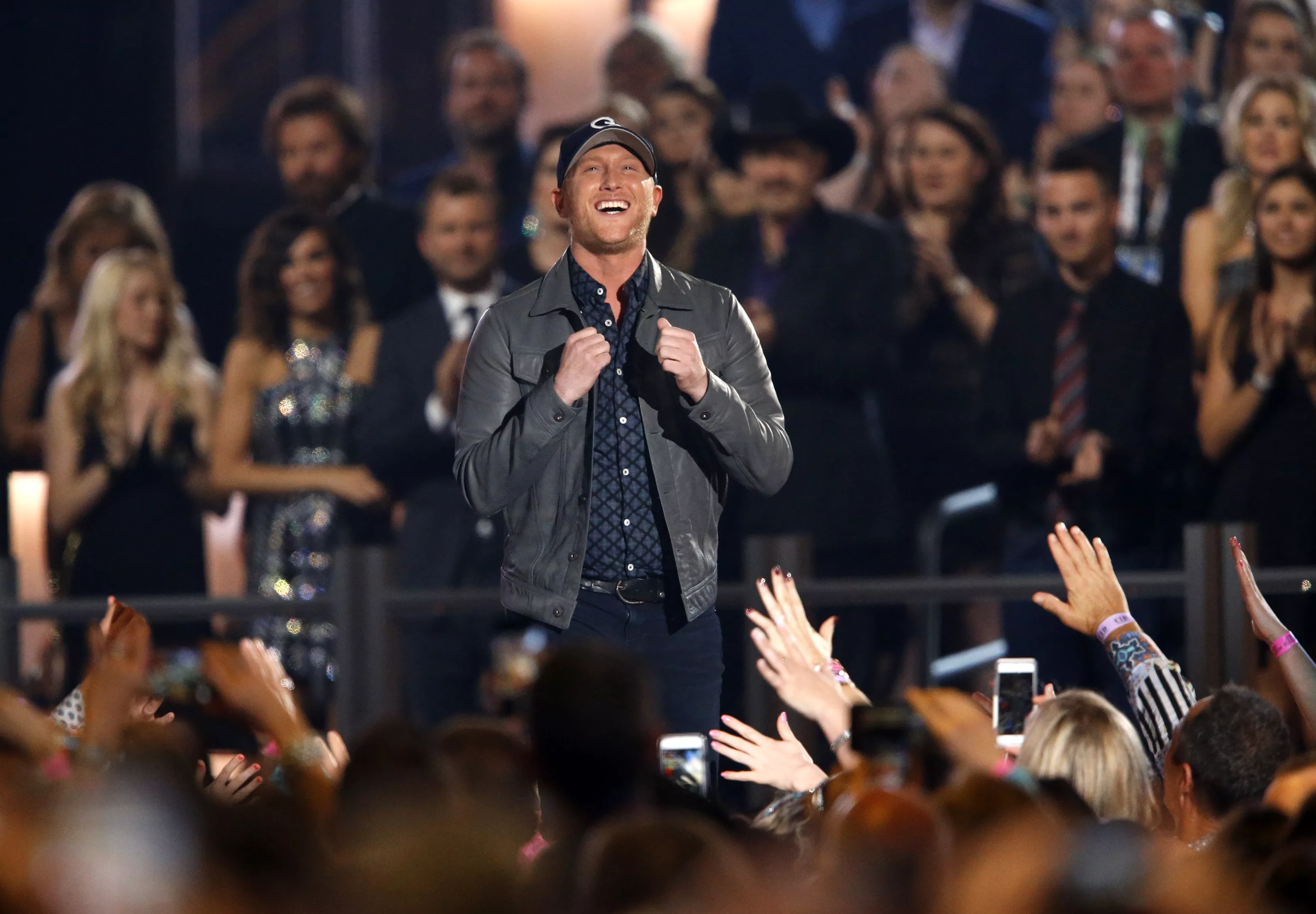 cole-swindell-takes-the-stage-to-accept-the-award-for-new-artist-of-the-year-at-the-50th-annual-academy-of-country-music-awards-in-arlington