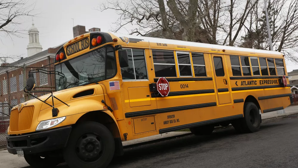a-school-bus-used-for-transporting-new-york-city-public-school-students-is-seen-parked-in-front-of-a-school-in-the-queens-borough-of-new-york