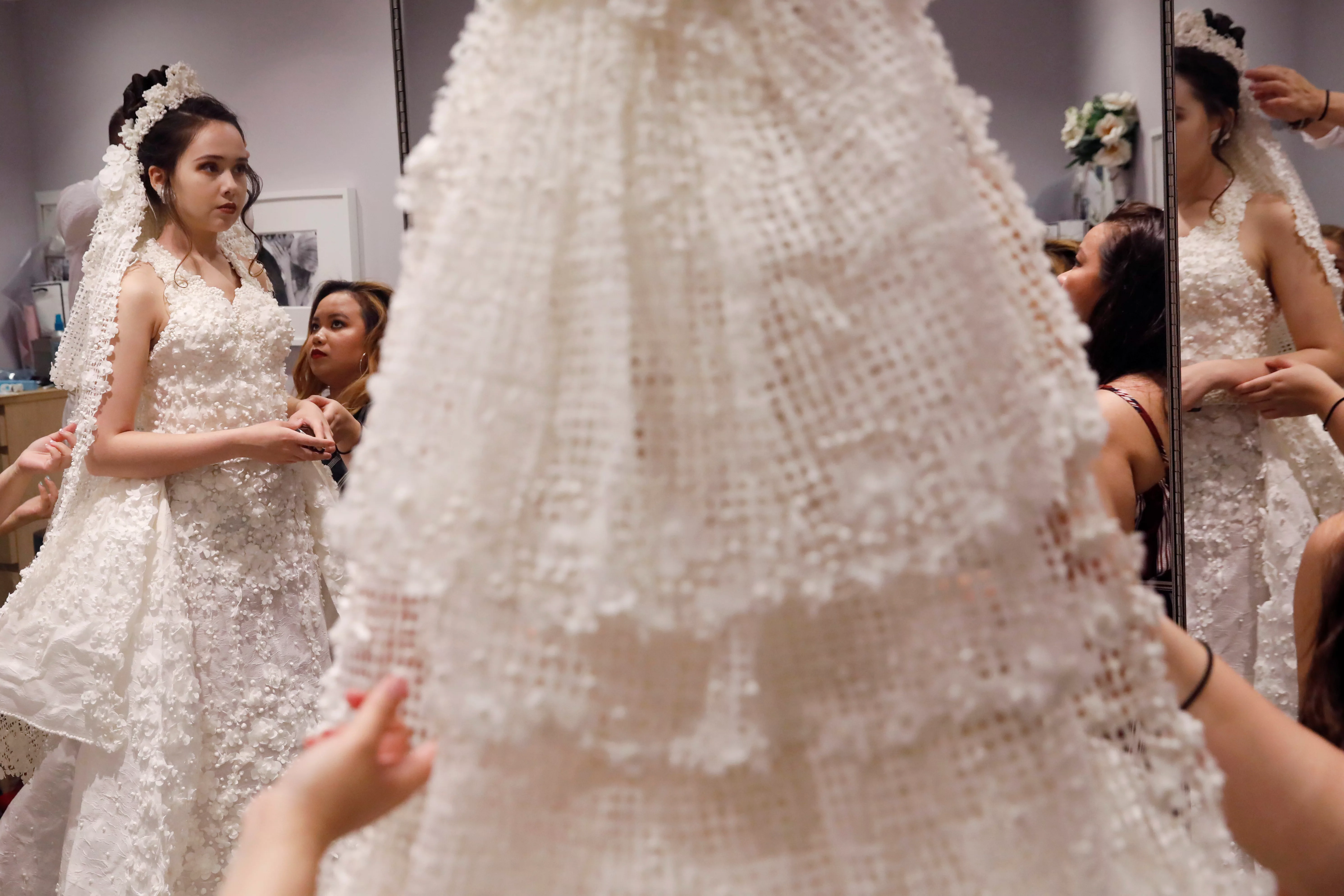 a-model-is-fitted-for-the-14th-annual-toilet-paper-wedding-dress-contest-in-manhattan