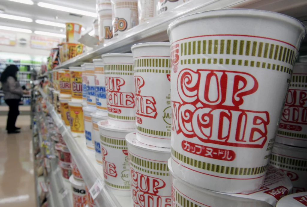 japans-instant-noodle-maker-nissins-cup-noodles-are-stacked-at-store-in-tokyo-2