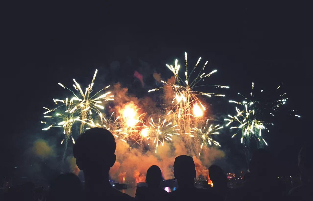 silhouetted-people-watching-a-fireworks-display