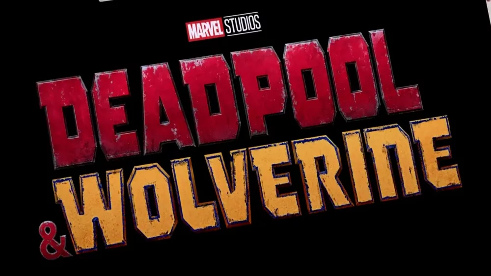 Logo of Deadpool and Wolverine movie on phone screen with movie trailer on the background on TV screen.