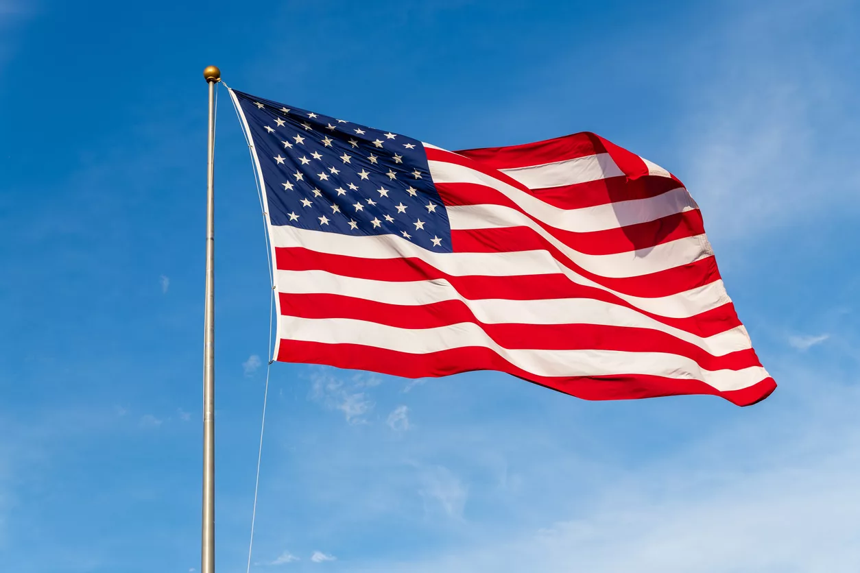 vibrant-colored-american-flag-waving-in-the-wind-lit-by-natural-sunlight