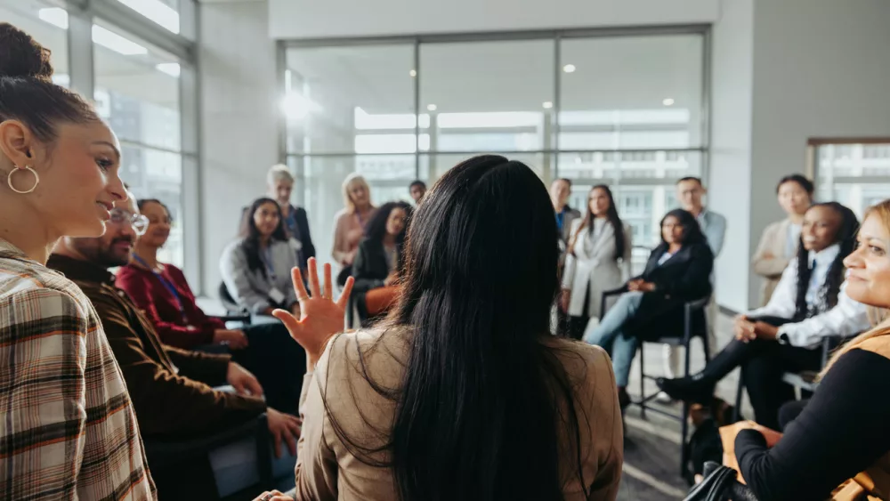 collaborative-team-meeting-coworkers-engaged-in-discussion-in-a-modern-office