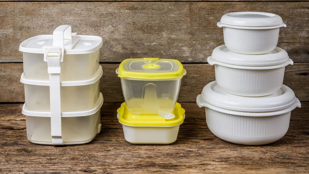 set-of-empty-tupperware-containers-for-food-on-wooden