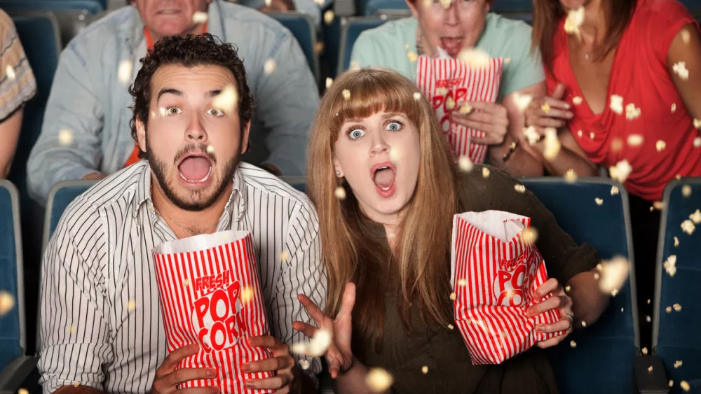 couple-with-scary-expressions-at-the-movies