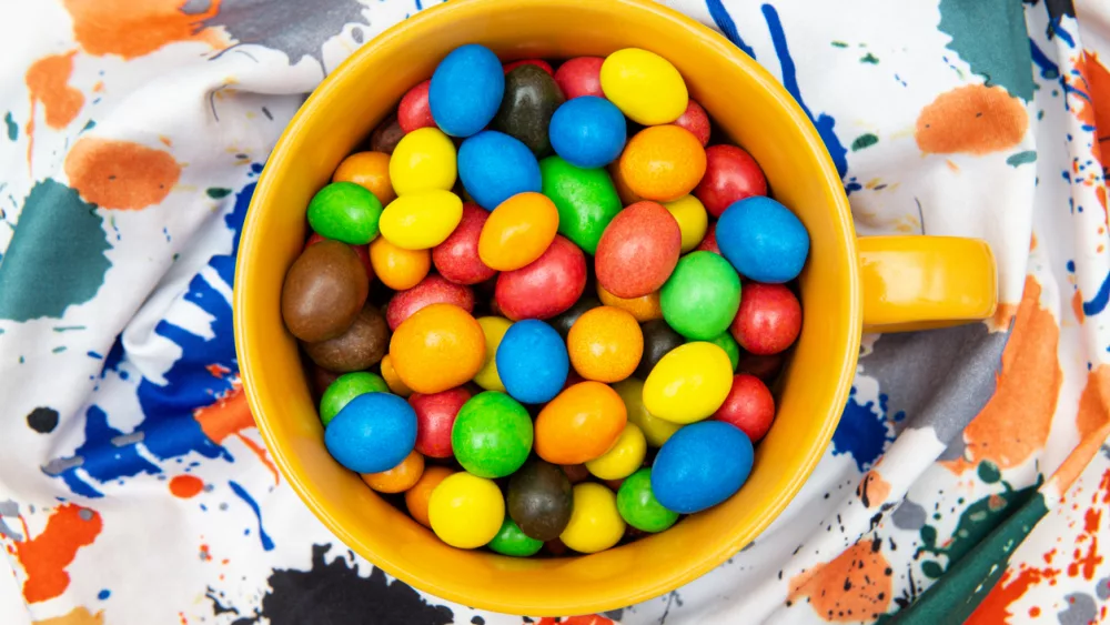 mug-full-of-multicolored-candy-dragees