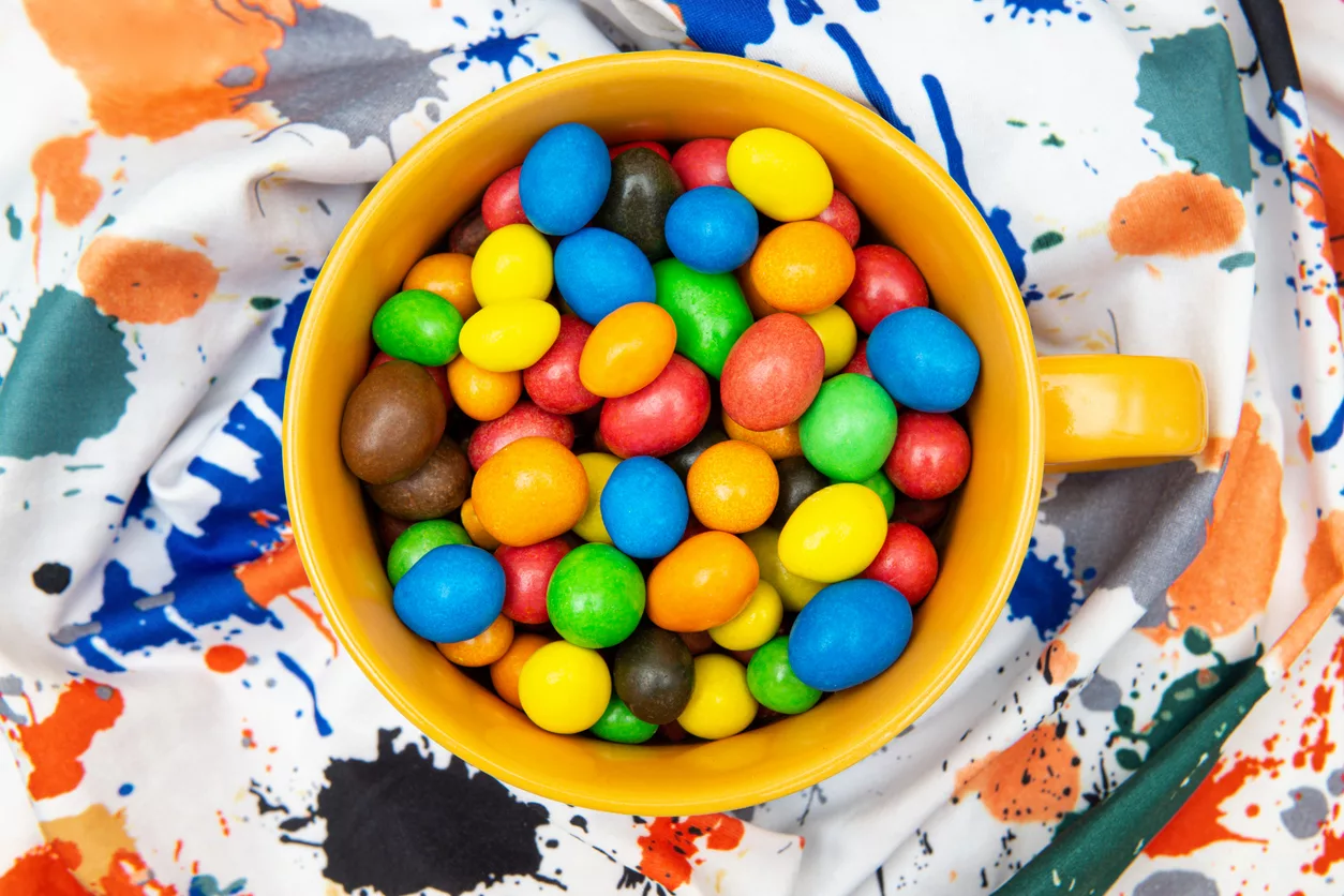 mug-full-of-multicolored-candy-dragees