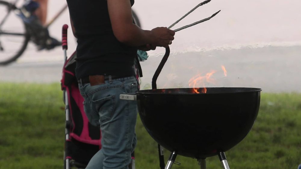 man-grills-at-flushing-meadows-park-in-the-queens-borough-of-new-york-city