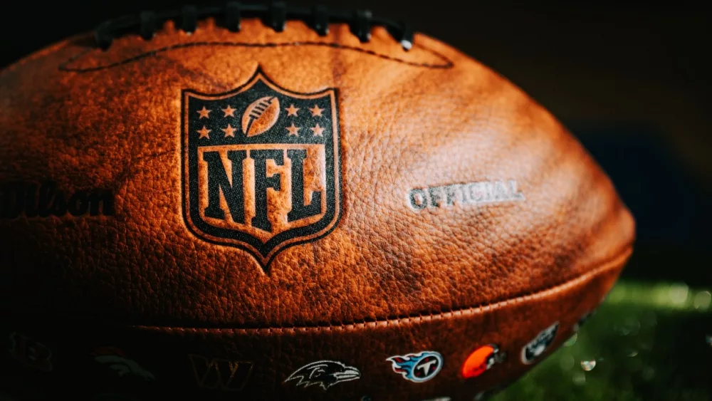 NEW YORK^ USA^ SEPTEMBER 11^ 2023: NFL Leather Ball and Emblem in Focus. National Football League official ball