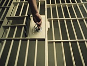 a-man-lockingunlocking-a-prison-cell-door-14