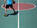 dribbling-ball-on-court-unsplash