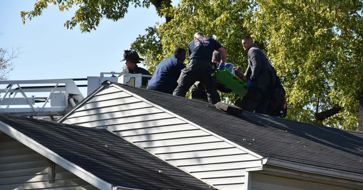 102829-indy-crash-woman-on-roof