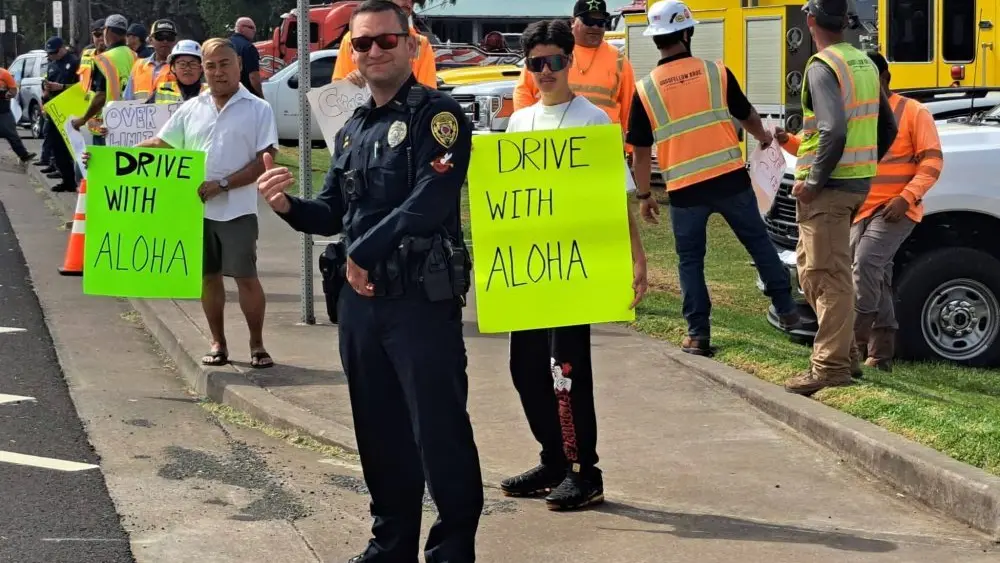 officer-roberg-with-sign-wavers-jpeg-3