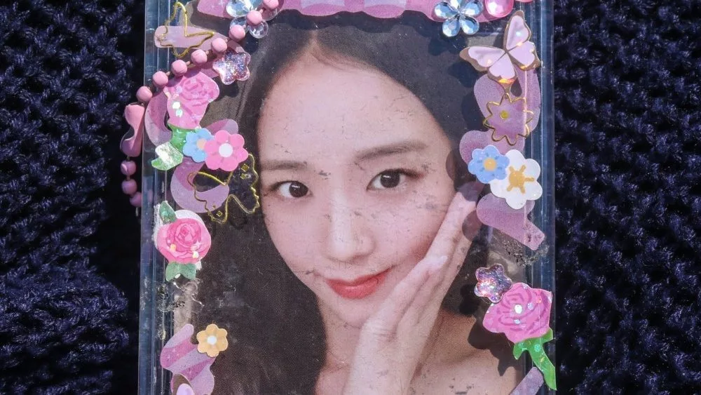 Photocard of girl group singer Kim Ji Soo or Jisoo of Blackpink. photocard of Jisoo blackpink isolated on blue background.