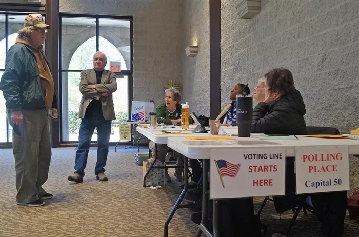 Poll workers at Westminster Presbyterian Church in Springfield wait for voters to arrive during balloting in the March 19, 2024, primary elections. (Capitol News Illinois photo by Peter Hancock)